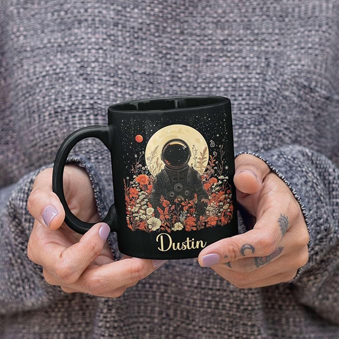 Astronaut with Moon and Wildflowers Coffee Mug, Custom Name Ceramic Cup 11oz 15oz, Unique Astronaut Coffee Cup for Friends, Personalized Astronomy Black Mug, Gifts for Birthday